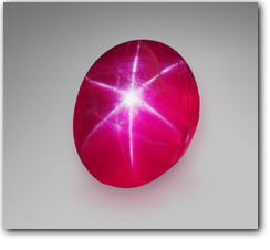 Pala International - A natural Burmese ruby cabochon with a perfect six-rayed star.